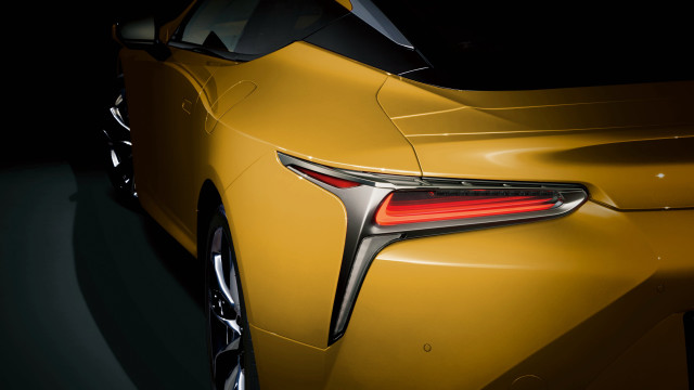 Yellow sports car closeup dark free wallpaper - medium preview image