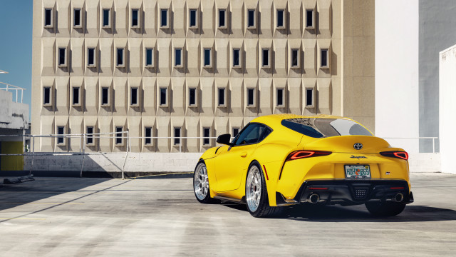 Yellow sports car building windowed free wallpaper - medium preview image