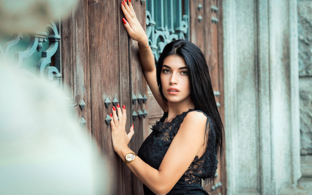 Woman black dress door handing free wallpaper - medium preview image