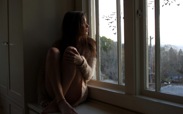 Woman sitting by window outside free wallpaper - medium preview image