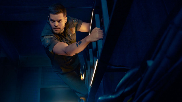 Man climbing stairs dark room free wallpaper - medium preview image