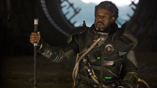 Man black suit holding sword free wallpaper - medium preview image