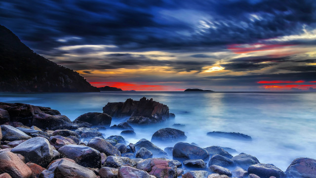 Rocky beach sunset water landsape free wallpaper - medium preview image