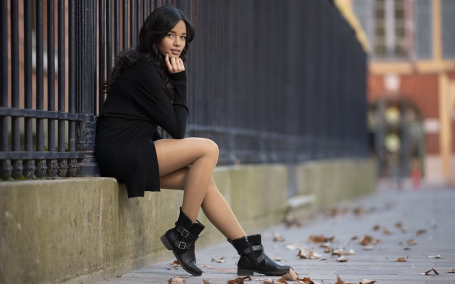Woman sitting wall crossed portrait #2 free wallpaper - medium preview image