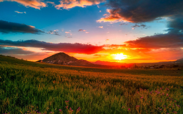Sunset field mountain clouds horizon free wallpaper - medium preview image