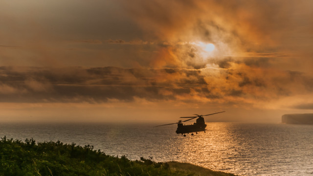 Helicopter over water cloudy sky free wallpaper - medium preview image