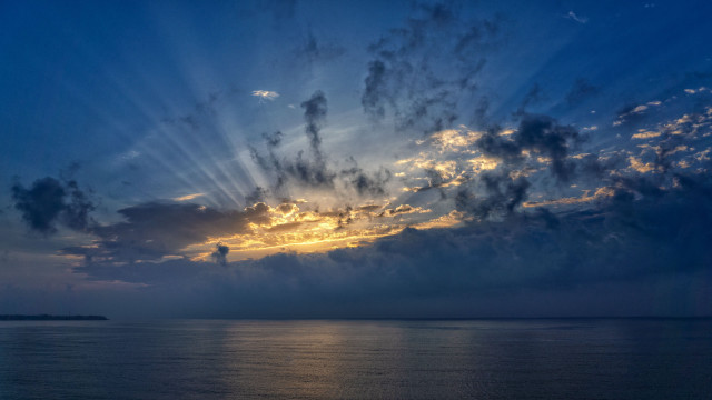 Ocean sky clouds sunrays city free wallpaper - medium preview image