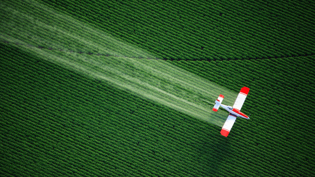 Plane green field smoke environmental free wallpaper - medium preview image