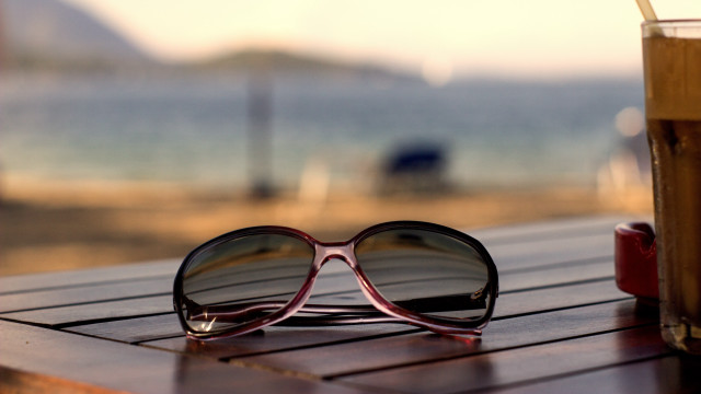 Sunglasses wooden table drink book free wallpaper - medium preview image