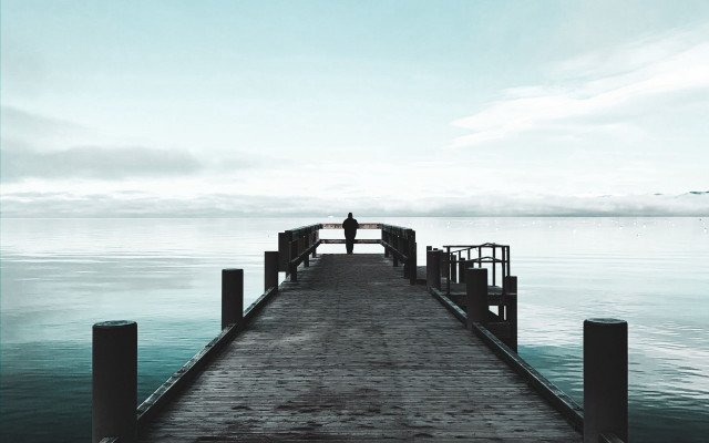 Docked person water clouds tranquil free wallpaper - medium preview image
