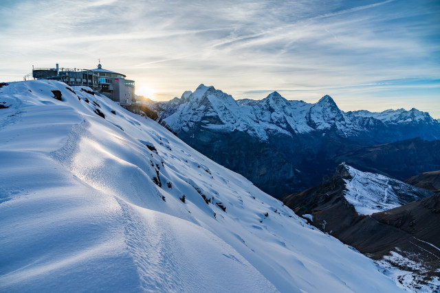Snowboarder snowy hill building mountains free wallpaper - medium preview image