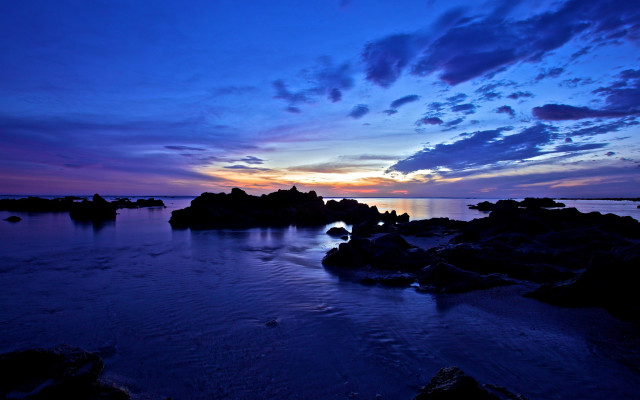 Sunset water rocks clouds beach free wallpaper - medium preview image