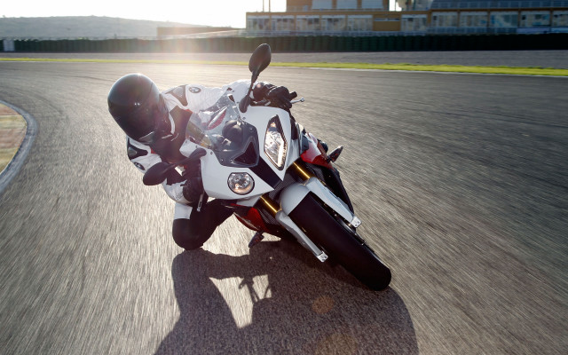 Motorcycle road building fence grass free wallpaper - medium preview image