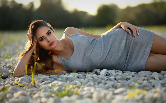 Woman rock ground crossed posing free wallpaper - medium preview image