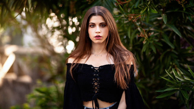 Woman black top tie portrait free wallpaper - medium preview image