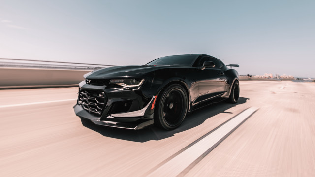 Black chevrolet camaro highway sun free wallpaper - medium preview image