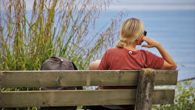 Woman bench water backpack ocean free wallpaper - medium preview image