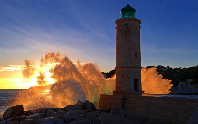 Lighthouse wave sunset ocean impressionist free wallpaper - medium preview image