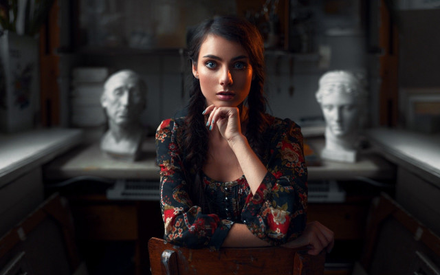 Woman sitting statues desk laptop free wallpaper - medium preview image