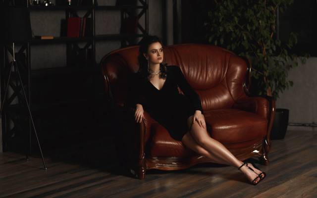 Woman black dress brown chair free wallpaper - medium preview image