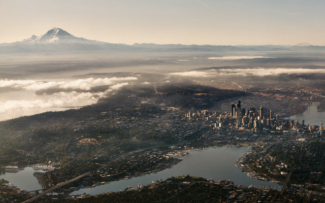 City clouds mountain airplane window free wallpaper - medium preview image