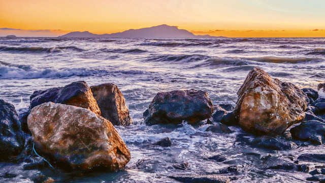 Rocks beach ocean sunset mountain free wallpaper - medium preview image