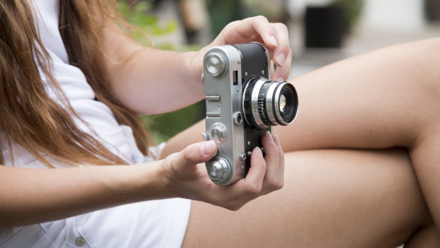 Woman camera sitting crossed ankazhuravleva free wallpaper - medium preview image