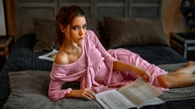 Woman pink dress bed reading free wallpaper - medium preview image