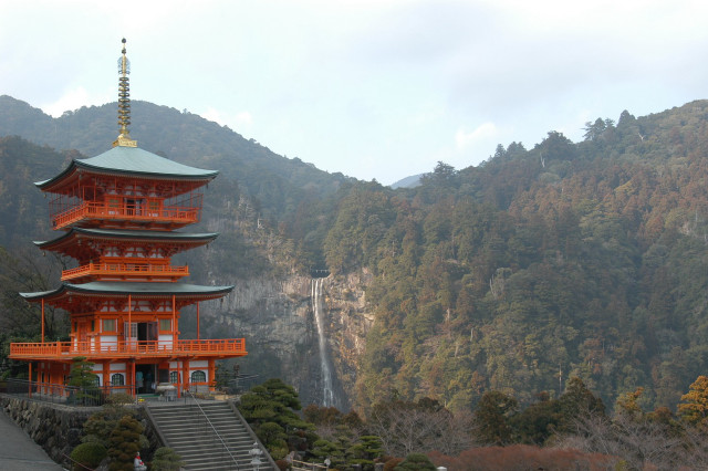 Tall pagoda steeple mountainside waterfall free wallpaper - medium preview image