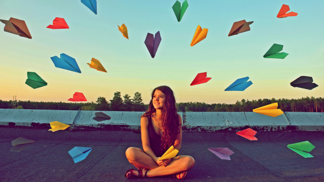 Woman sitting colorful umbrellas surreal free wallpaper - medium preview image