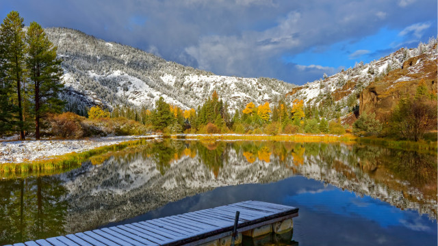 Snowy mountain lake boat dock free wallpaper - medium preview image