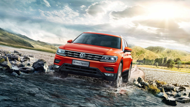 Red volkswagen suv river rocks free wallpaper - medium preview image