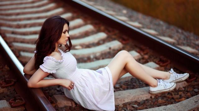 Woman sitting train track fashion free wallpaper - medium preview image