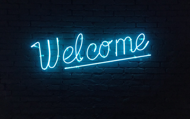 Neon welcome brick wall dark free wallpaper - medium preview image