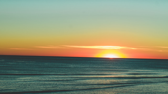 Sunset ocean surfer boat cloud free wallpaper - medium preview image