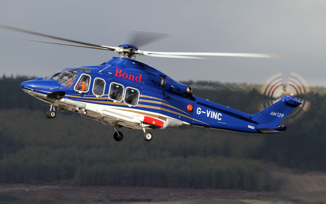 Blue helicopter forest cloudy day free wallpaper - medium preview image