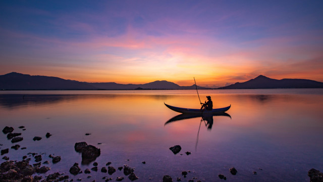 Sunset mountain lake boat man free wallpaper - medium preview image