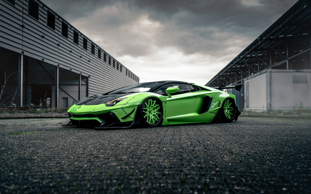 Green sports car cloudy building free wallpaper - medium preview image