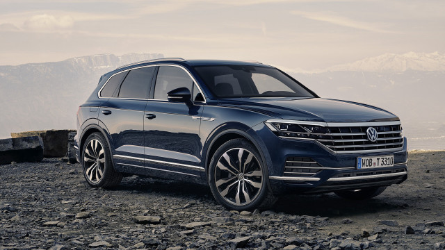 Blue volkswagen suv mountains water free wallpaper - medium preview image