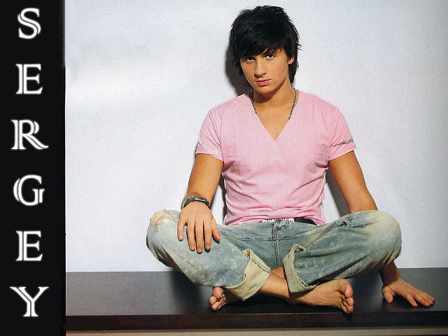 Man sitting crossed legs denim free wallpaper - medium preview image