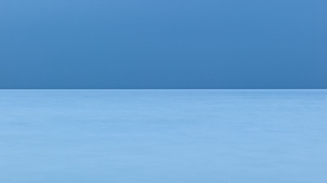 Lone bird blue surface sky free wallpaper - medium preview image