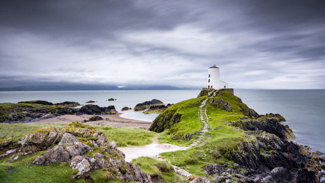 Lighthouse rocky outcrop cloudy day free wallpaper - medium preview image