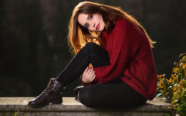 Woman sitting ledge red sweater free wallpaper - medium preview image