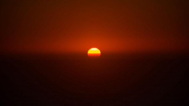 Sunset orange sun black background free wallpaper - medium preview image