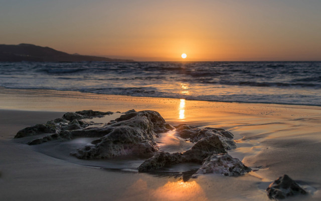 Sunset ocean rocks beach mountain free wallpaper - medium preview image