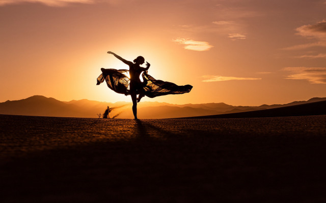 Dancing couple dirt sunset mountains free wallpaper - medium preview image