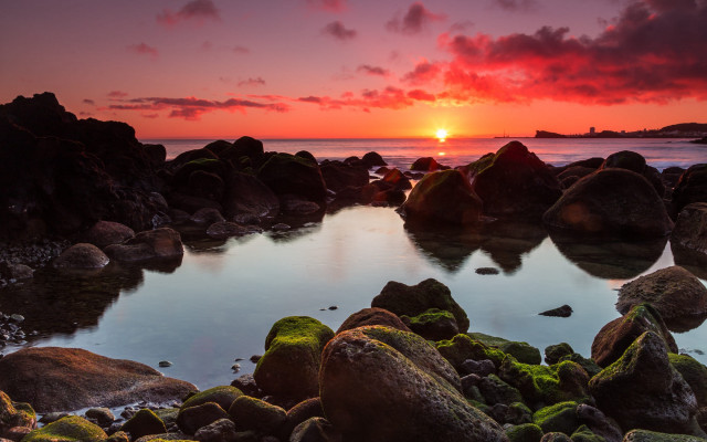 Sunset rocky beach mountains ocean free wallpaper - medium preview image