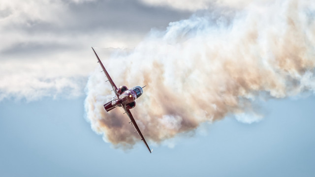 Small plane cloudy sky smoke free wallpaper - medium preview image