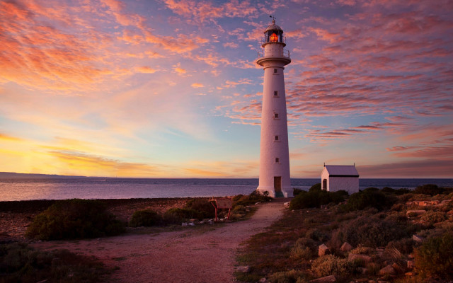 Lighthouse rocky shore sunset clouds #14 free wallpaper - medium preview image