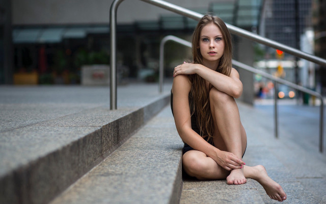 Woman sitting railing stairs bokeh free wallpaper - medium preview image